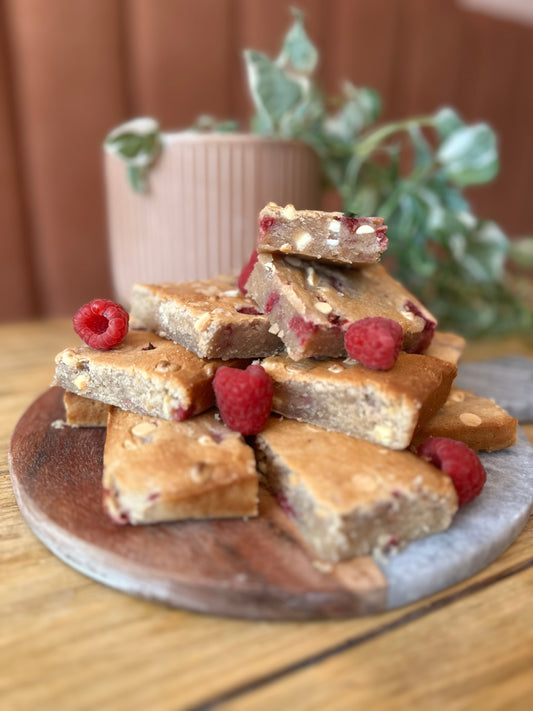 Handmade White Chocolate and Raspberry Blondies - Benny's Bakes